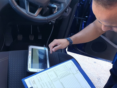 Diagnostic equipment in use on Ford Grand C-Max during ITV import test Engineer uses diagnostic equipment