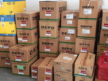 Selection of headlights waiting to be fitted to vehicles Replacement headlights (boxed)